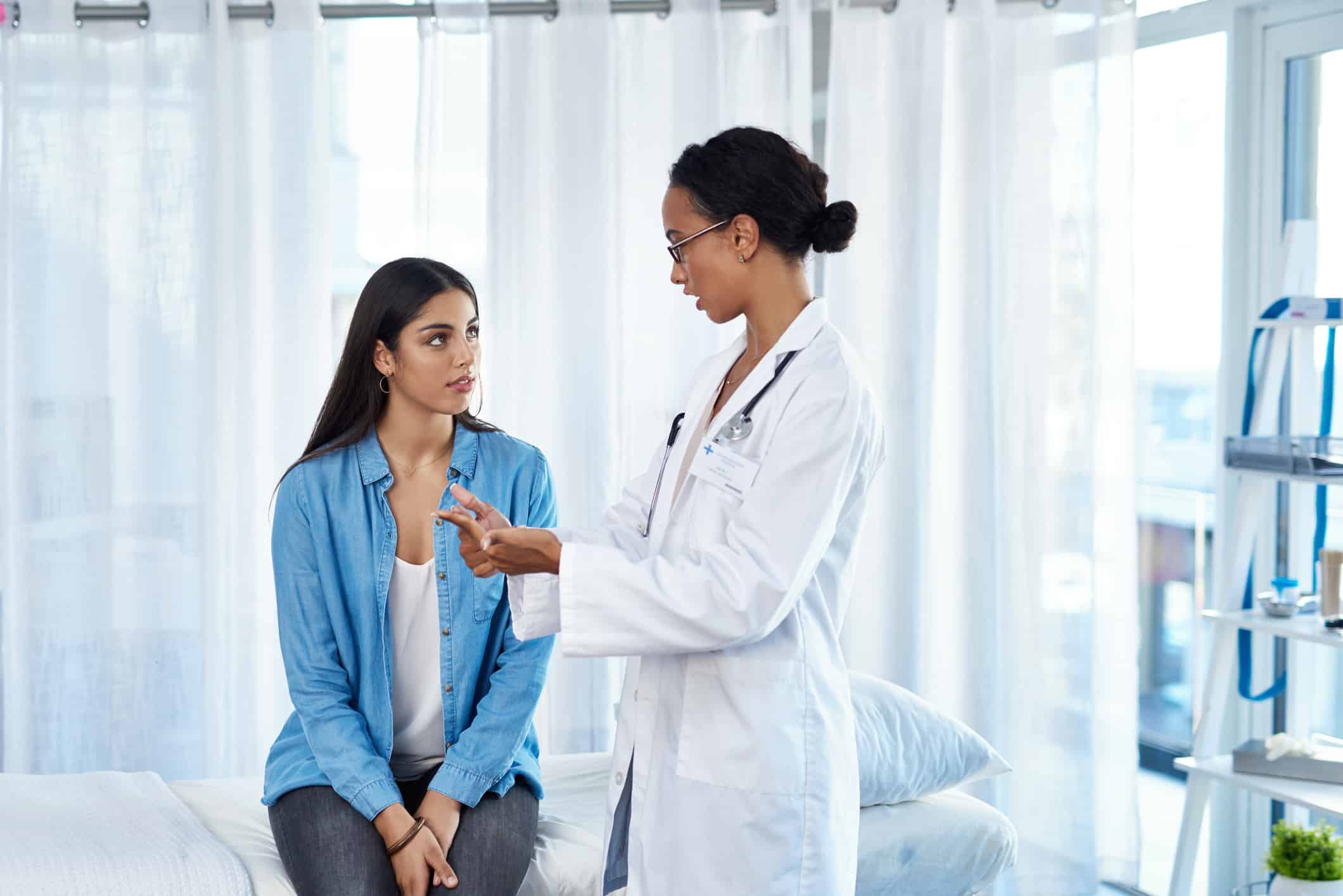 gynecologist talking with a woman