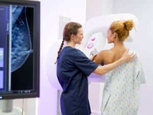 Patient at the mammogram system